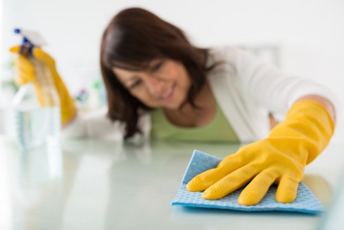 Technician treating upholstery stains in St Giles